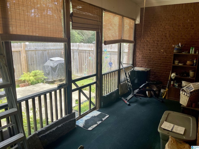 sunroom / solarium featuring a healthy amount of sunlight