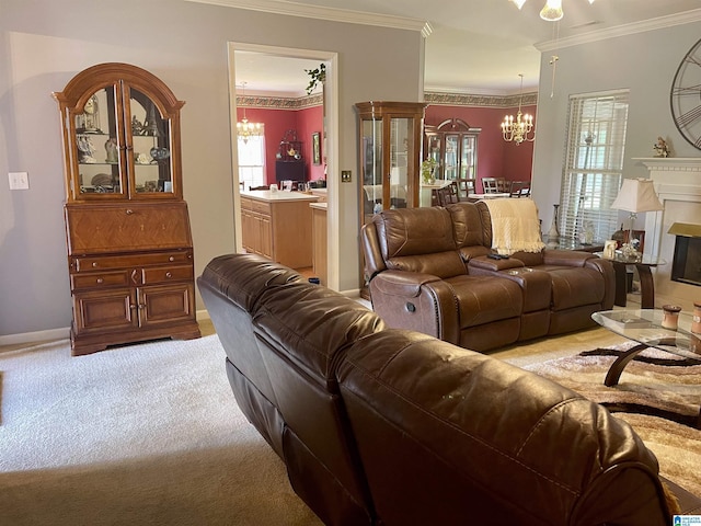 carpeted living room featuring crown molding, a healthy amount of sunlight, and a notable chandelier