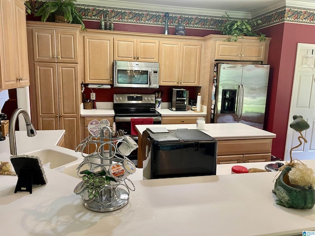 kitchen featuring ornamental molding, appliances with stainless steel finishes, sink, and light brown cabinets