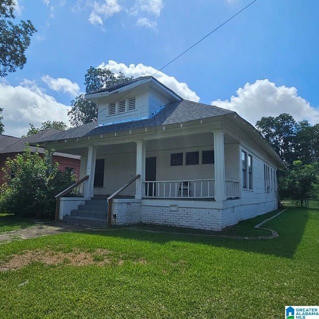 bungalow with a front yard