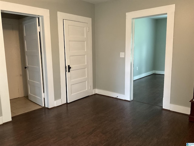 empty room featuring dark hardwood / wood-style floors