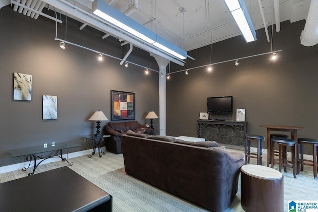 living room with a towering ceiling