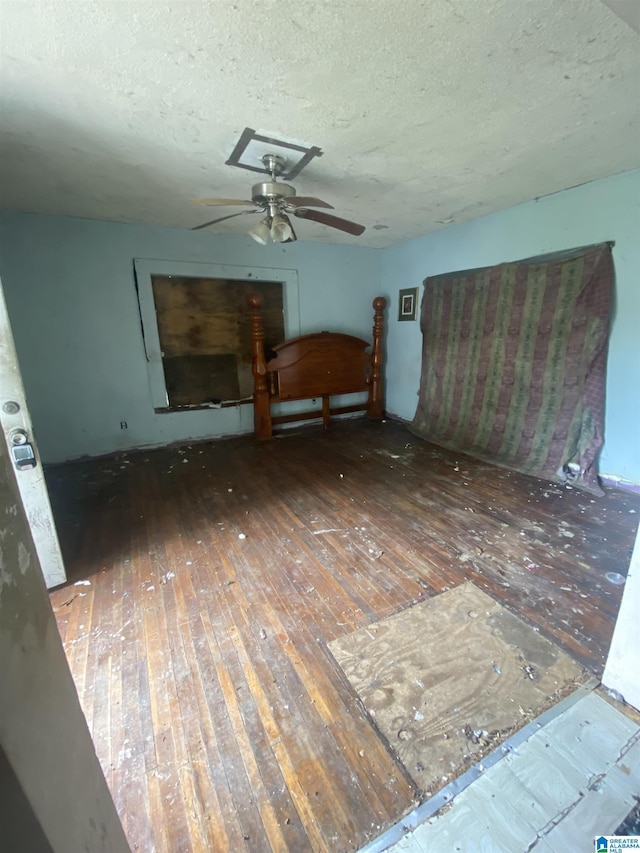 interior space featuring dark hardwood / wood-style flooring and a textured ceiling