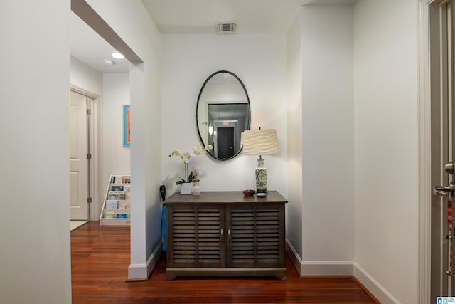 hall with dark wood-type flooring