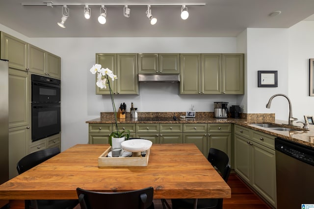 kitchen with black appliances, sink, dark hardwood / wood-style floors, green cabinetry, and track lighting