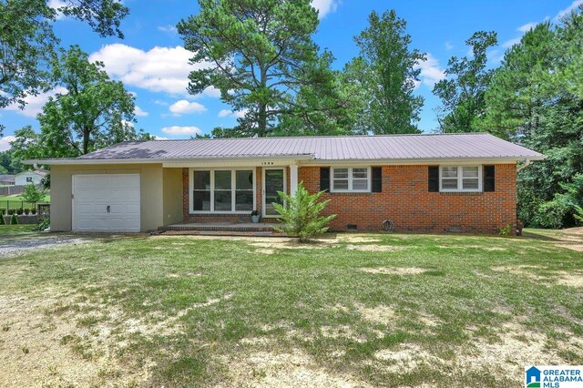 single story home with a front yard, an attached garage, metal roof, and crawl space