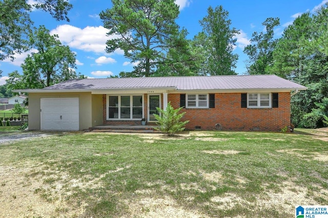 ranch-style house featuring a garage and a front lawn