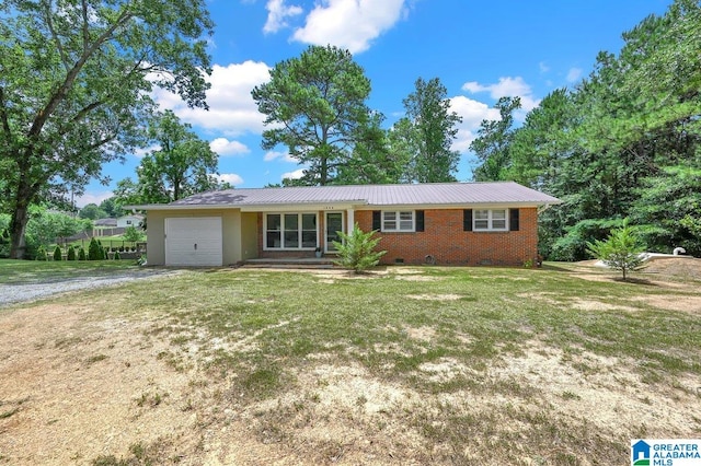 ranch-style house featuring a front lawn, driveway, a garage, and crawl space