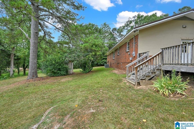 view of yard featuring a wooden deck