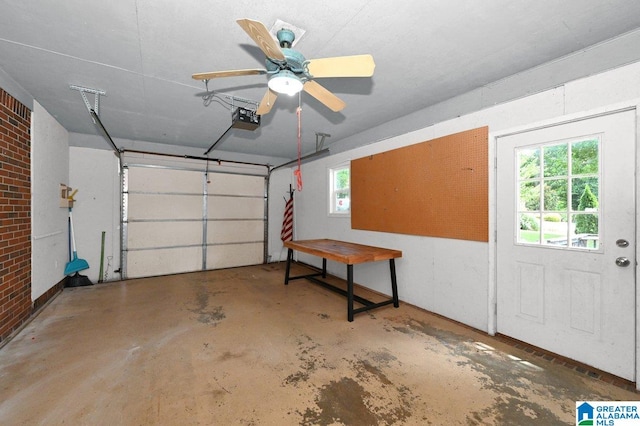 garage featuring a garage door opener and ceiling fan