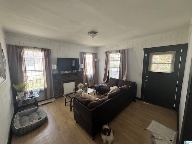 living room featuring a fireplace and hardwood / wood-style floors