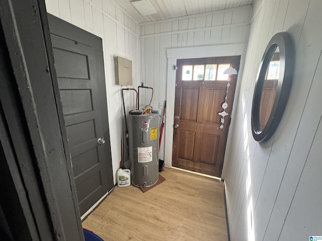 utility room featuring electric water heater