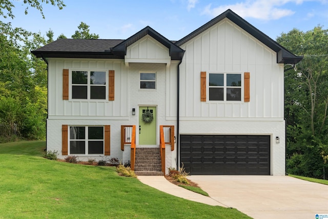 view of front of home featuring a front lawn and a garage