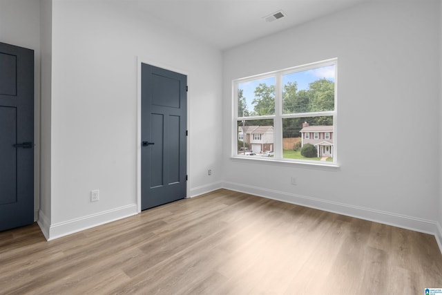 unfurnished bedroom with light hardwood / wood-style flooring