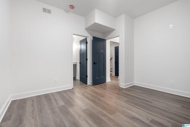 empty room with dark wood-type flooring