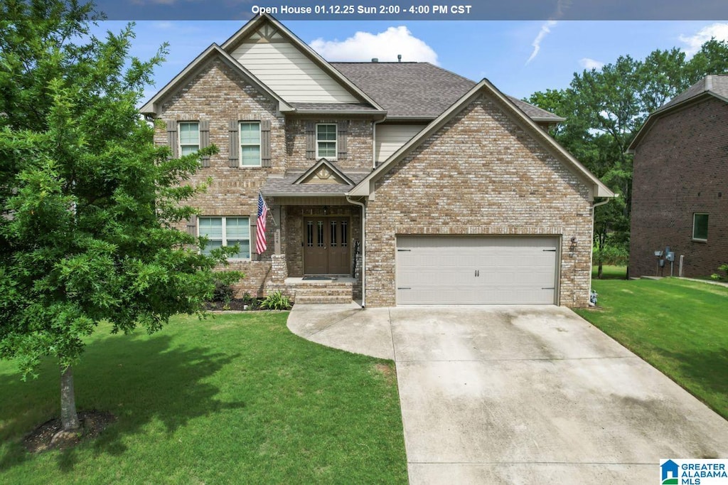 craftsman-style home featuring a front yard and a garage