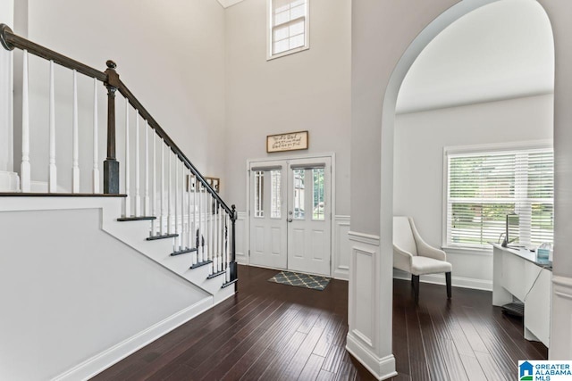 entryway with dark hardwood / wood-style floors