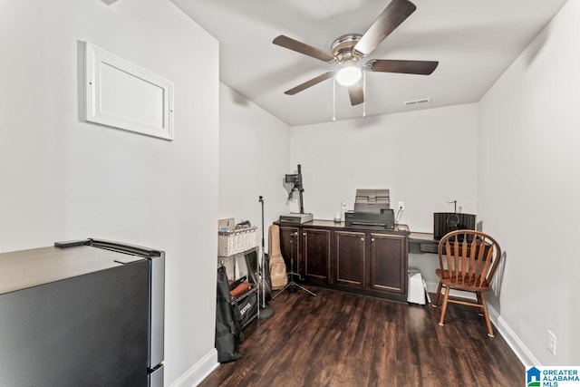 office area featuring dark hardwood / wood-style flooring and ceiling fan