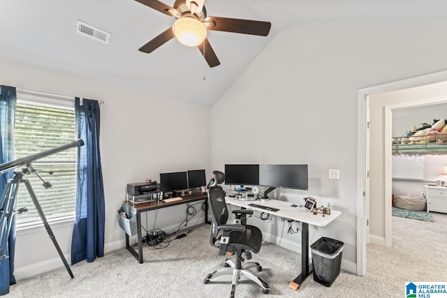 carpeted office featuring ceiling fan, plenty of natural light, and vaulted ceiling