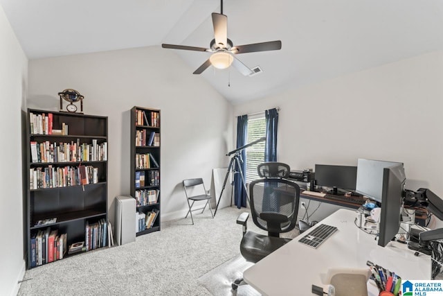 carpeted office space with vaulted ceiling and ceiling fan