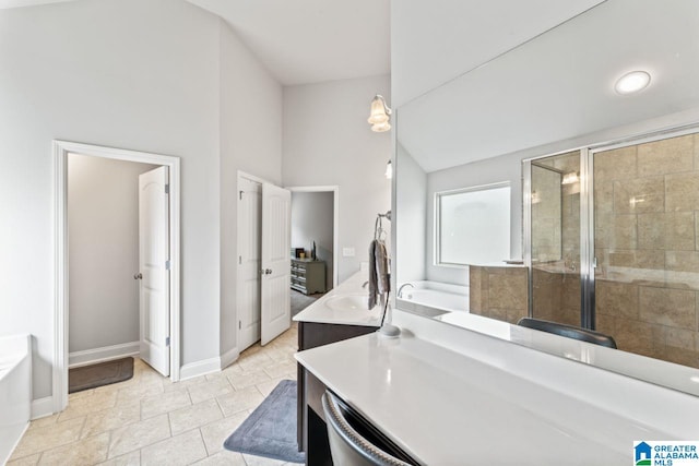 bathroom featuring plus walk in shower and vanity