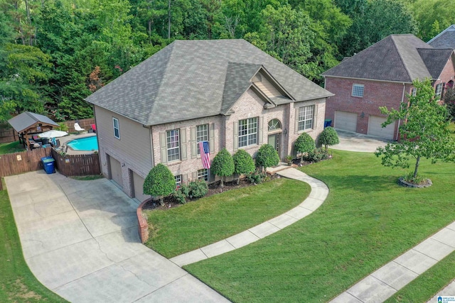 view of front of house featuring a front yard and a garage