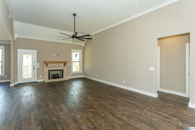 unfurnished living room with baseboards, dark wood-style flooring, and crown molding