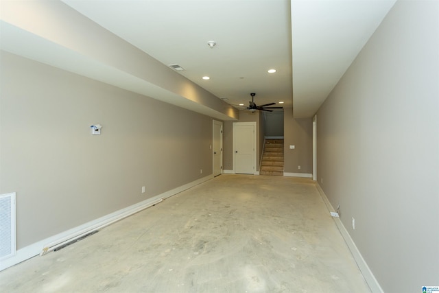 empty room featuring recessed lighting, a ceiling fan, visible vents, stairs, and baseboards