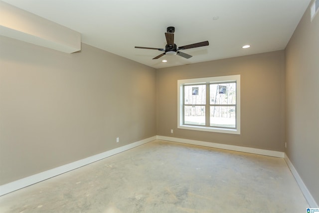 spare room featuring baseboards, ceiling fan, recessed lighting, and unfinished concrete floors