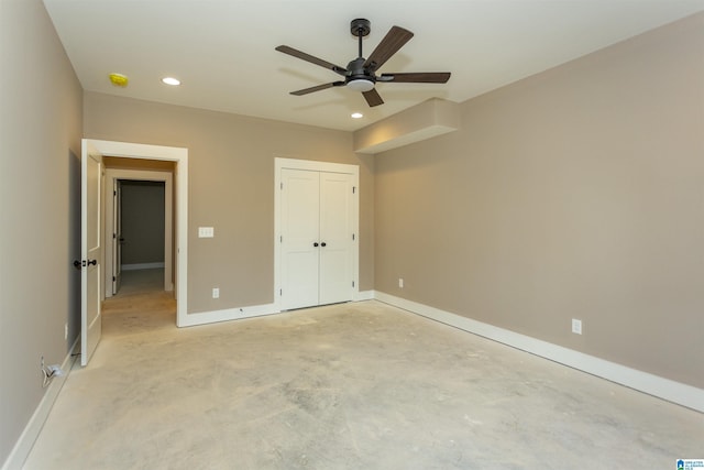 unfurnished bedroom featuring baseboards, a closet, recessed lighting, and unfinished concrete floors