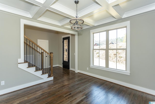 foyer entrance featuring stairs, baseboards, coffered ceiling, and a wealth of natural light