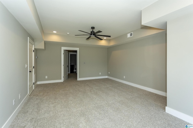 carpeted spare room featuring recessed lighting, visible vents, ceiling fan, and baseboards