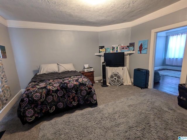 carpeted bedroom with a textured ceiling