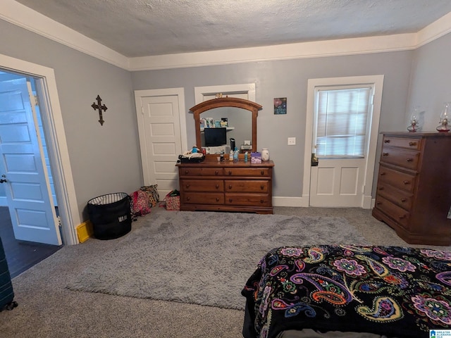 carpeted bedroom featuring a textured ceiling and crown molding