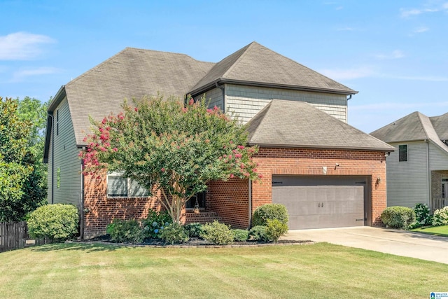 view of front facade with a garage and a front yard