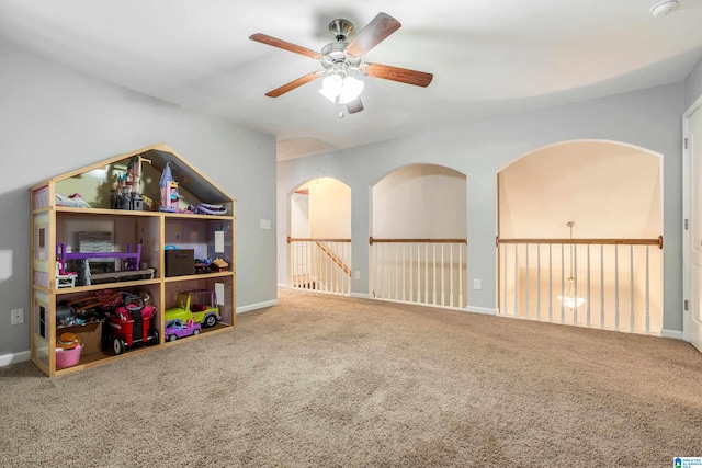 recreation room with carpet floors and ceiling fan