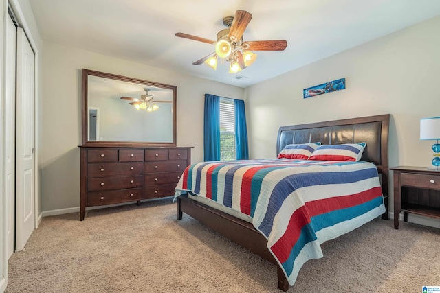 bedroom with a closet, carpet floors, and ceiling fan