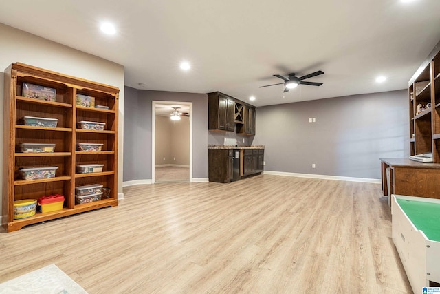 living room with ceiling fan and light hardwood / wood-style floors