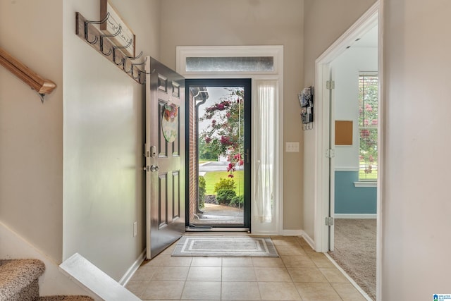 tiled foyer entrance featuring a healthy amount of sunlight