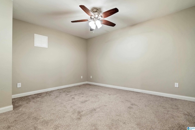 carpeted empty room featuring ceiling fan