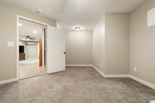 interior space with a wall mounted air conditioner and ceiling fan