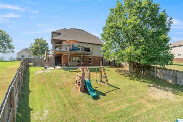 view of yard featuring a wooden deck and a patio area