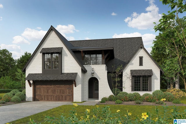 view of front of property featuring a garage and a front yard