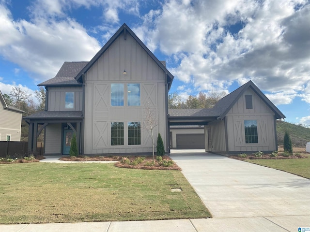 view of front of home featuring a garage and a front lawn