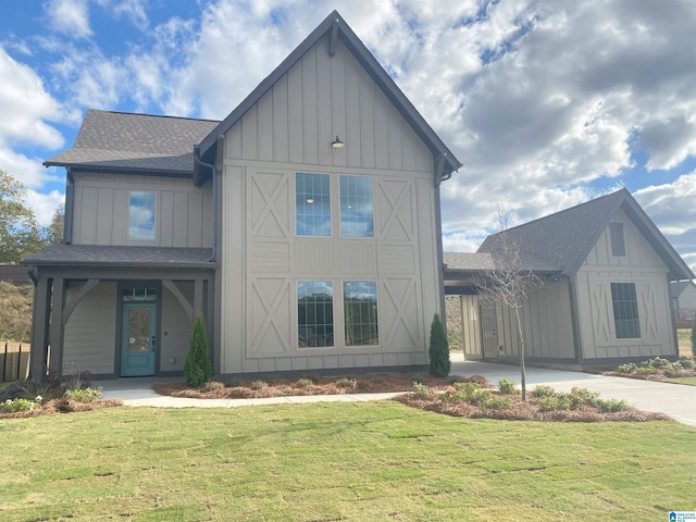 modern farmhouse with a front lawn