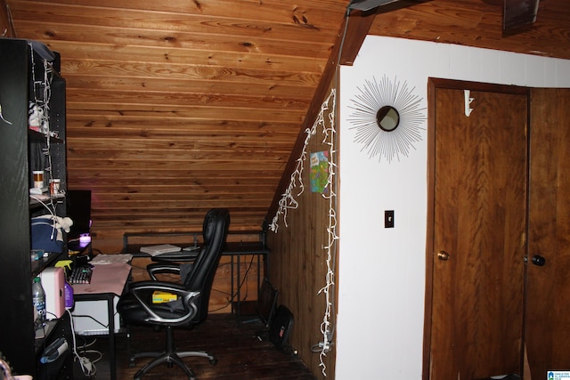 office area featuring dark wood-type flooring, wooden walls, and lofted ceiling