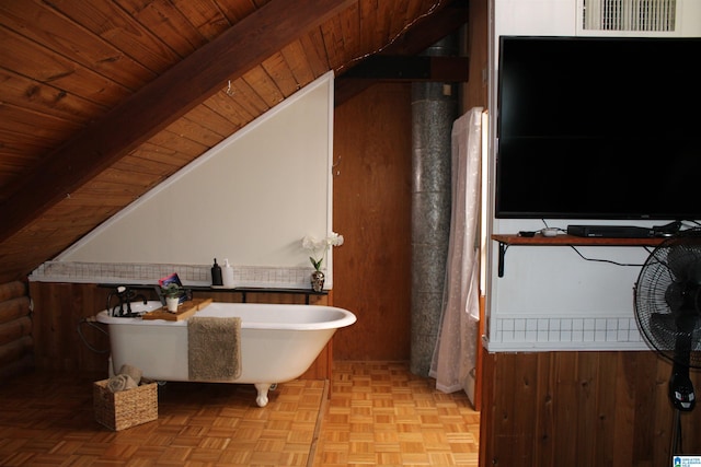 bathroom featuring a tub, wood ceiling, vaulted ceiling, and parquet flooring