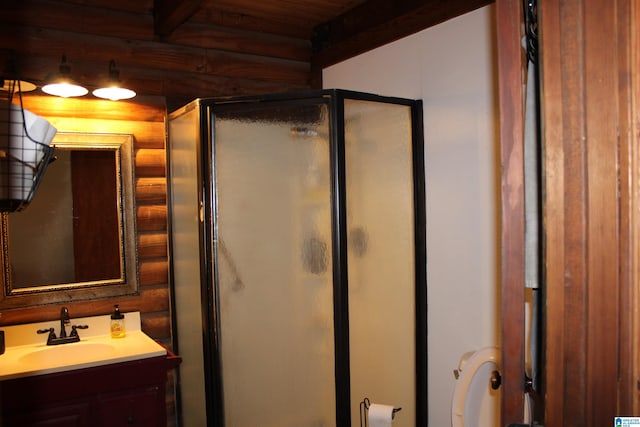 bathroom featuring a shower with shower door, vanity, wooden ceiling, and rustic walls