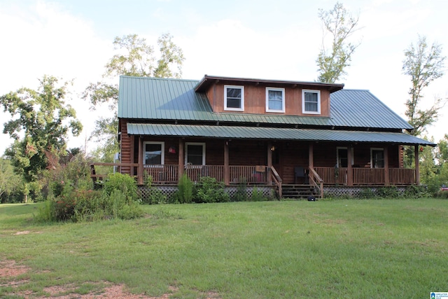 view of front of home with a porch and a front yard