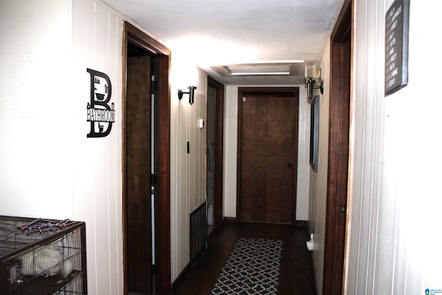 hall featuring dark wood-type flooring